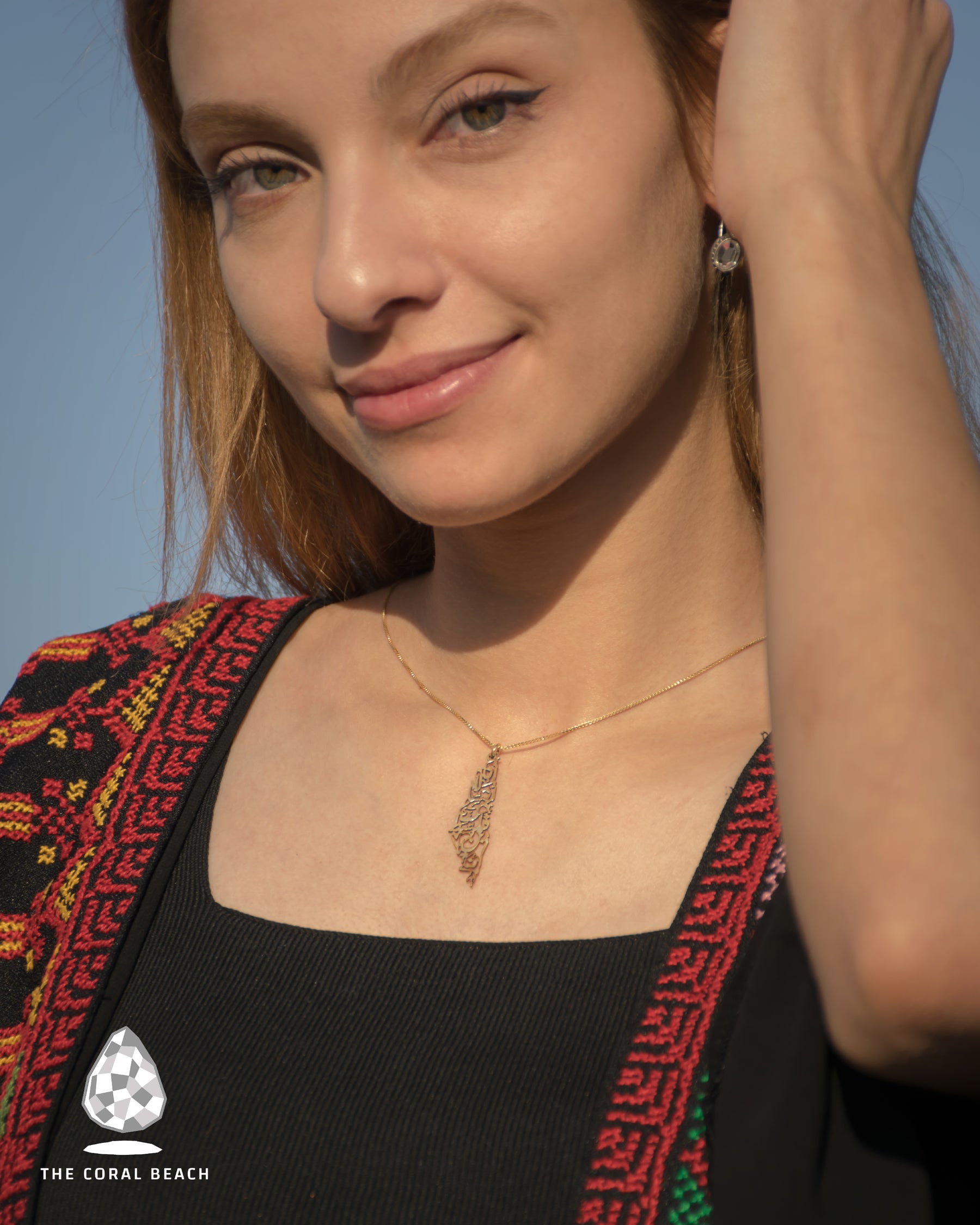 Palestine map with Palestinian famous song written inside necklace