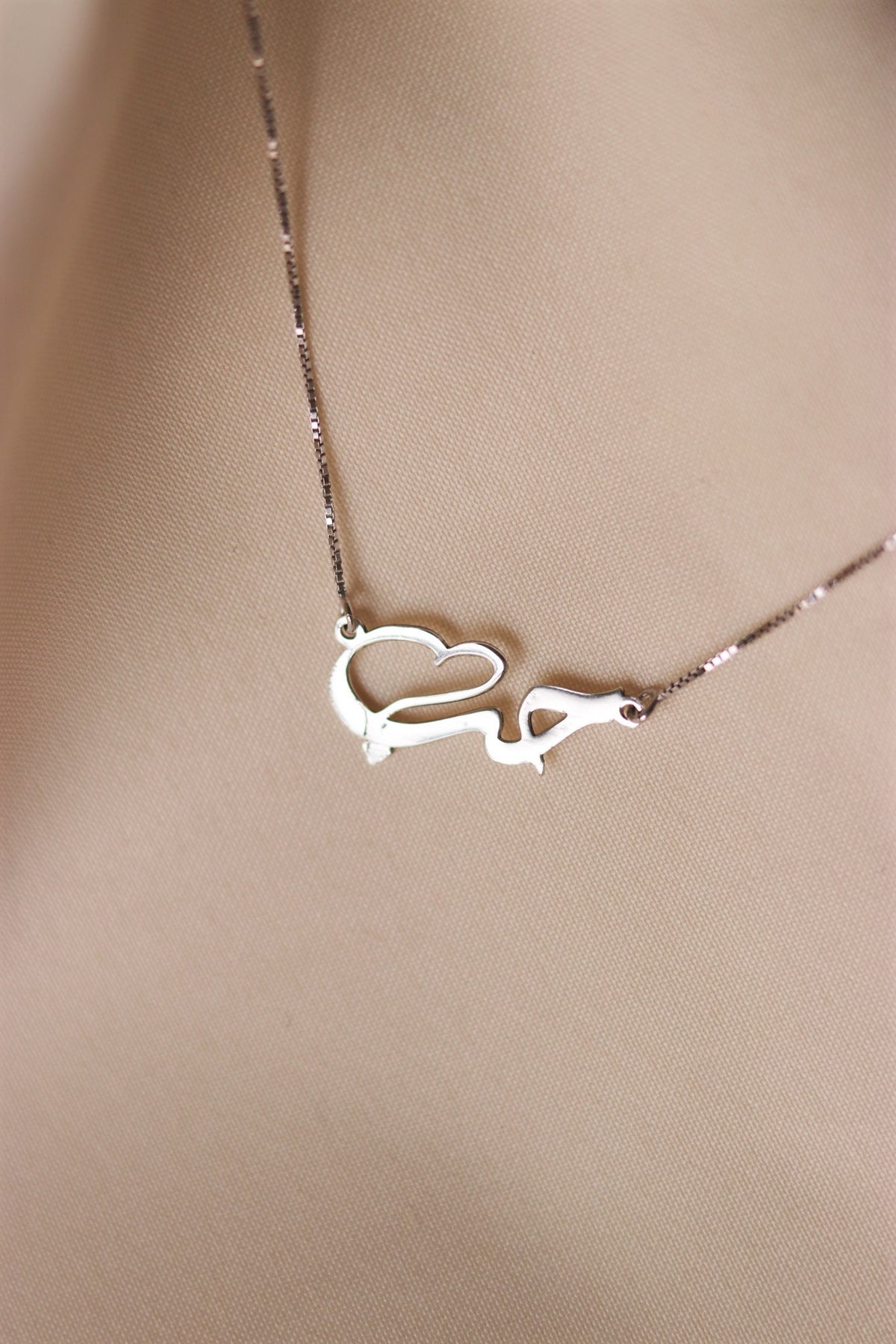 "Love" word in Arabic necklace