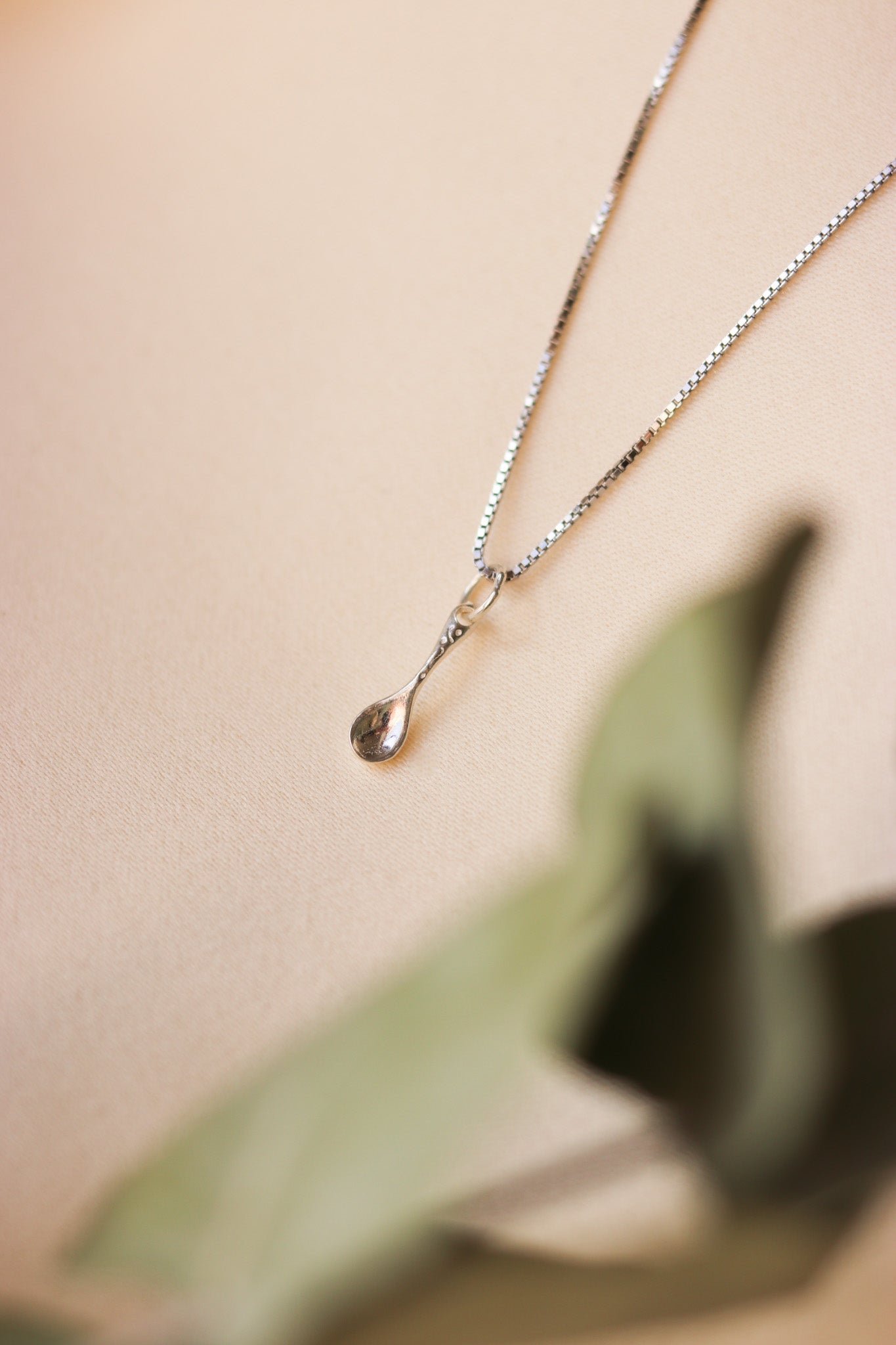 Symbolic spoon necklace